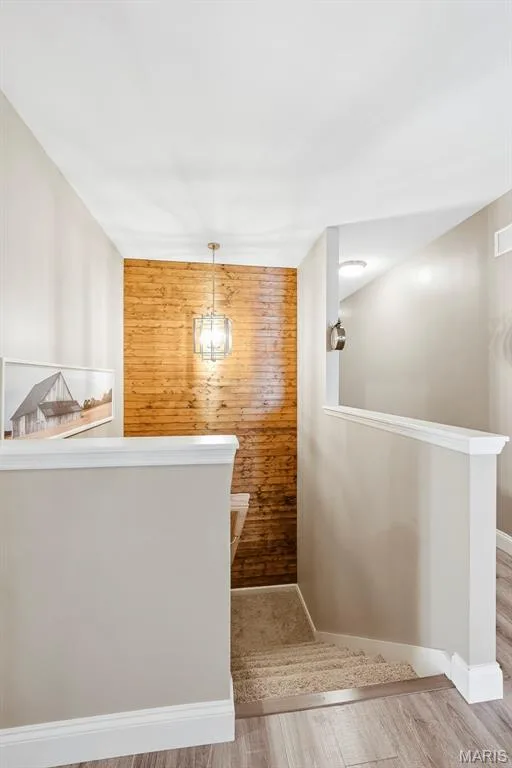 Rustic accent wall to lower level — 513 Country Chase Drive, Lake St. Louis, MO 63367