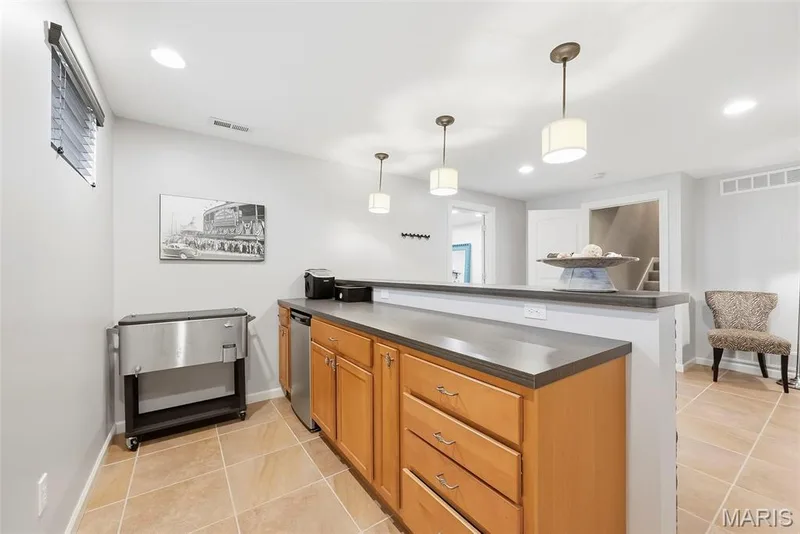 Pendant lighting over the bar — 513 Country Chase Drive, Lake St. Louis, MO 63367