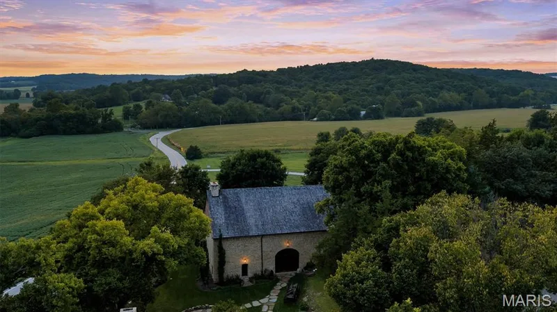 Stone-clad exterior with arched entry — 2275 Highway F, Defiance, MO 63341