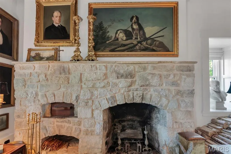 Stone fireplace with an arched firebox, stone hearth, and integrated wood-fired oven — 2275 Highway F, Defiance, MO 63341