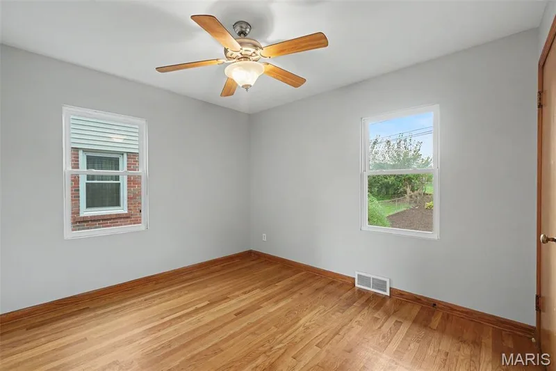 Second bedroom, hardwood flooring and light/ceiling fan combo. — 502 Pine Street, St Charles, MO 63301