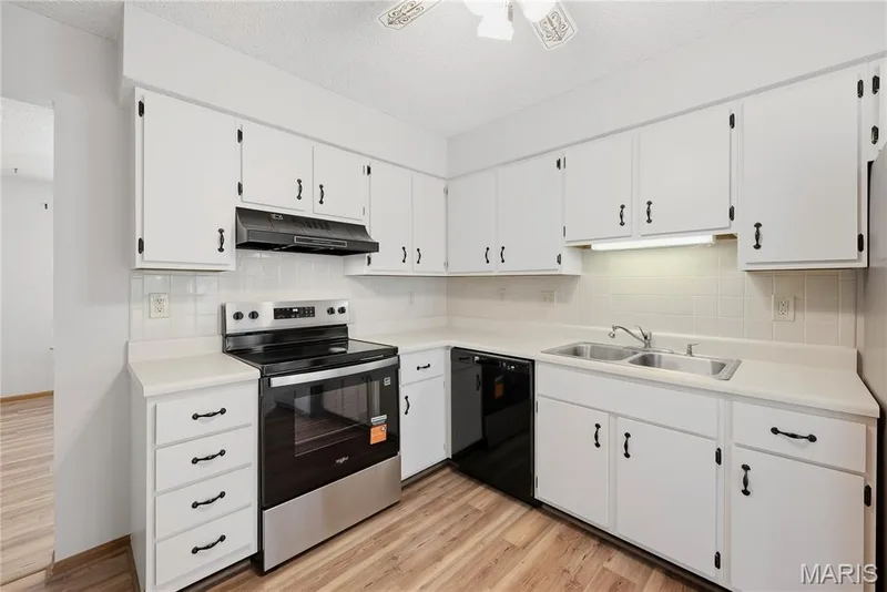 NEW Luxury Vinyl Wood Plank Floors flow into the Eat-In Kitchen with NEW Stainless Smooth-Top Oven & Dishwasher! — 1278 Stephenridge Drive, St Charles, MO 63304