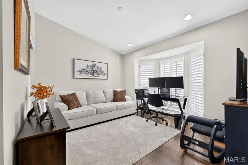 Main floor office with bay window with plantation shutters and recessed lighting — 14737 Ladue Bluffs Crossing Drive, Chesterfield, MO 63017