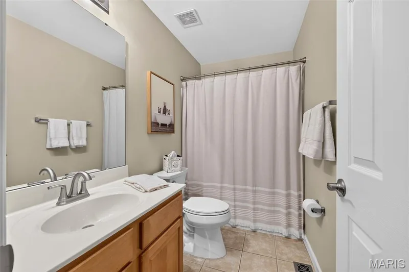 Main floor full bath with tub and brushed nickel faucet — 14737 Ladue Bluffs Crossing Drive, Chesterfield, MO 63017