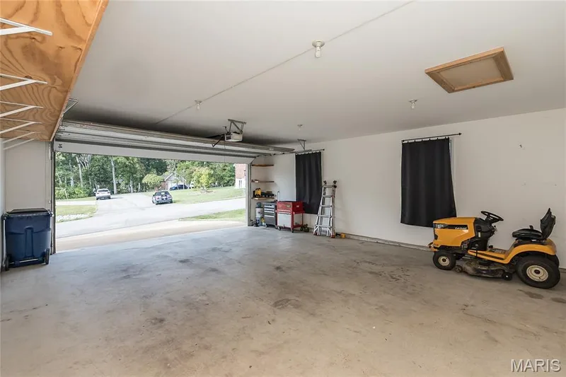 Oversized garage could fit a boat. 28 ft deep, all finished. — 10495 Walnut Lane, Foristell, MO 63348
