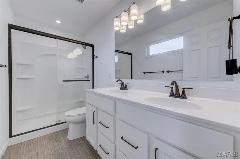 Primary Bathroom with Double Bowl Vanity and Large Shower — 337 Dalriada Boulevard, O'Fallon, MO 63368