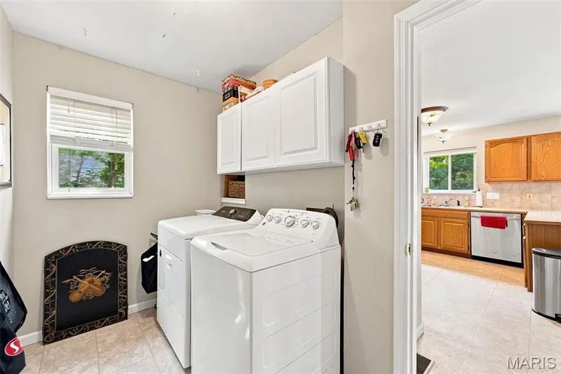 The most convenient laundry/mud room! Attached to the garage for easy unloading directly into the kitchen — 16337 Centerpointe Drive, Grover, MO 63040