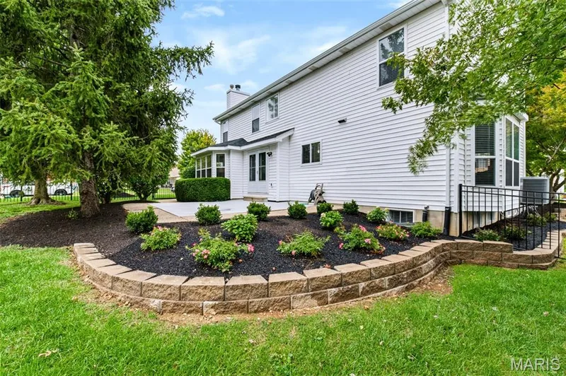 Large 24'by 20' patio overlooking updated landscaping with fenced in backyard. — 209 Harbour Pointe Drive, Grover, MO 63040
