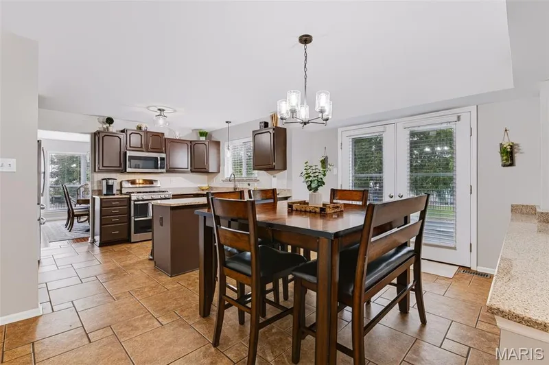 Eat in kitchen W/granite countertops and stainless steel appliances — 209 Harbour Pointe Drive, Grover, MO 63040