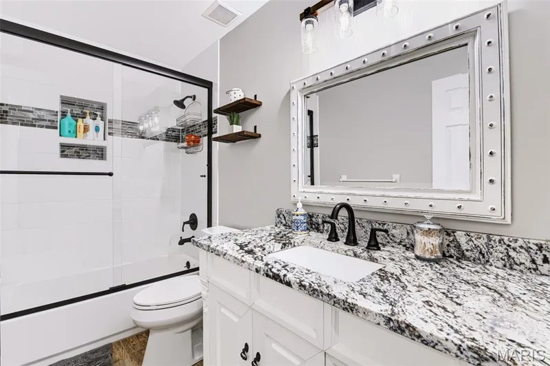 Updated hall bath with granite and LVP flooring — 209 Harbour Pointe Drive, Grover, MO 63040