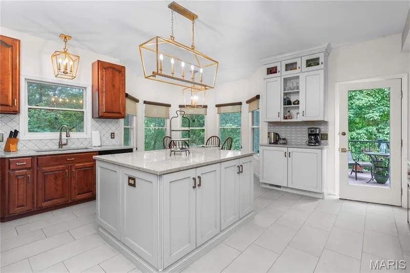 The recently remodeled eat-in kitchen combines luxury and beauty. — 19342 Dogwood Valley Court, Wildwood, MO 63038