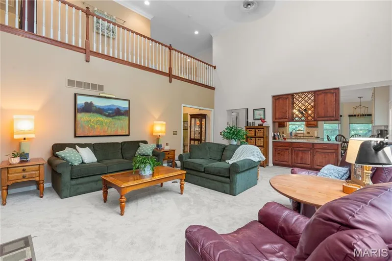 Overlook the grand great room from the upper-level railing, — 19342 Dogwood Valley Court, Wildwood, MO 63038