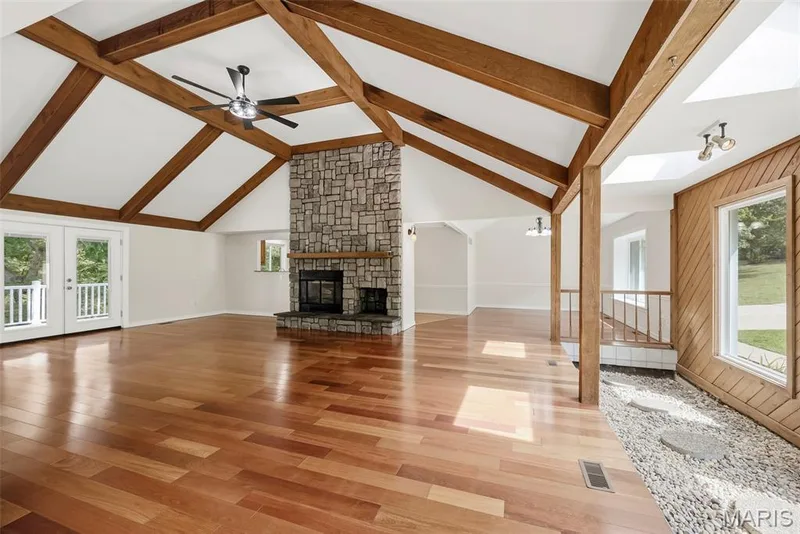 This gorgeous vaulted living space with wood burning fire place ready to make memories. — 18409 Woodland Meadows Drive, Wildwood, MO 63038