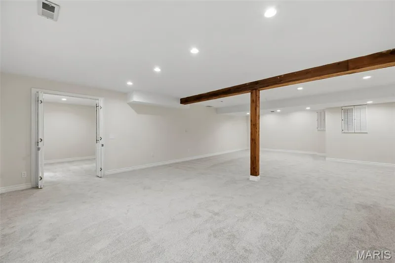 Media room with view into bonus room. — 18409 Woodland Meadows Drive, Wildwood, MO 63038