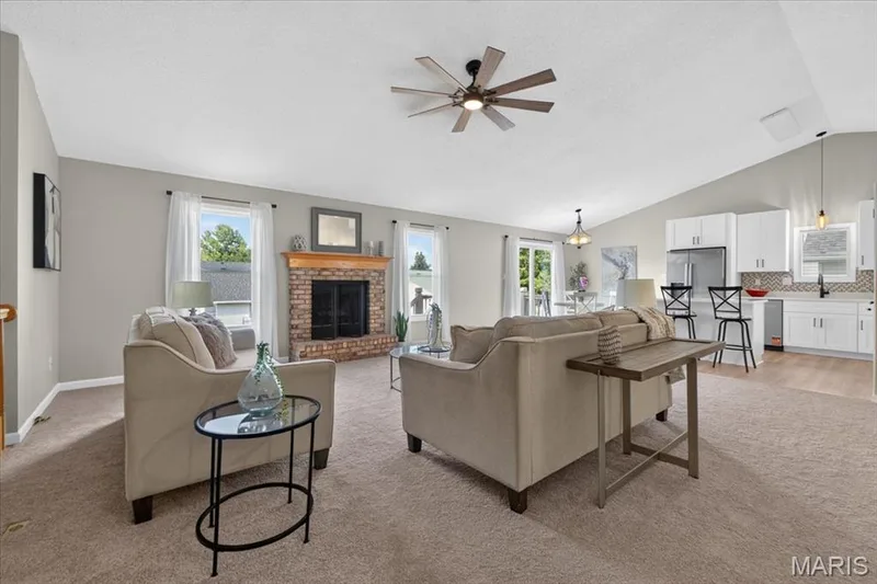 Brick fireplace with wood mantel — 89 Gregory Court, Wentzville, MO 63385