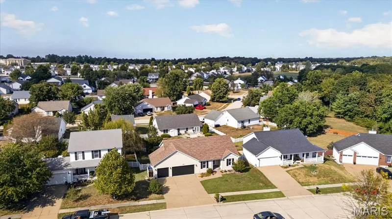Residential neighborhood featuring a variety of home styles and mature trees — 89 Gregory Court, Wentzville, MO 63385