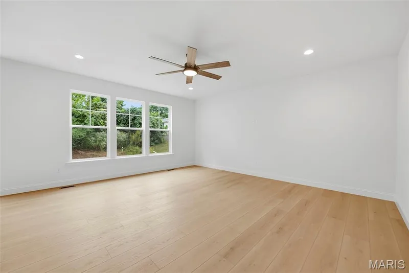 Great Room with 9 Foot Ceilings, Recessed Lighting and Luxury Vinyl Plank Flooring — 547 Ryehill Drive, St Peters, MO 63376