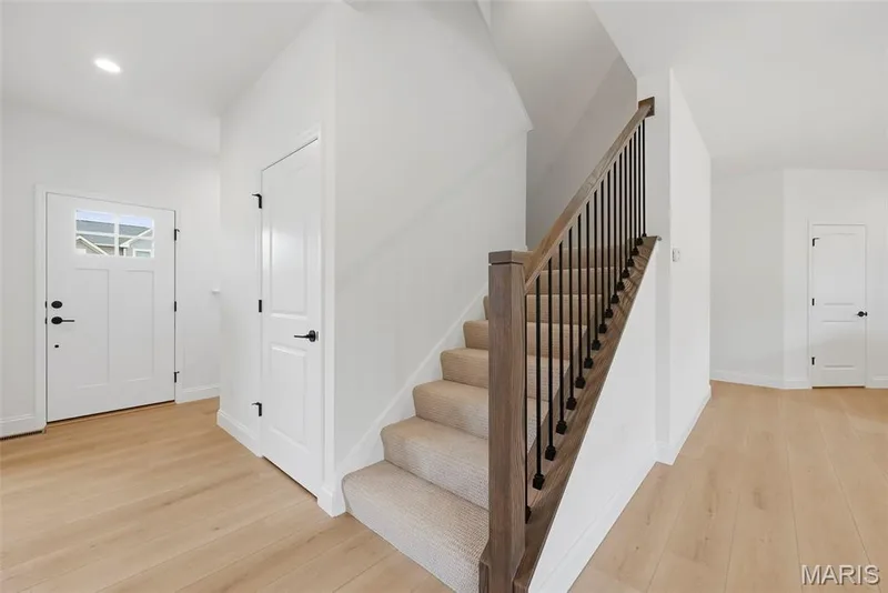 Entry Foyer and Staircase with Wrought Iron Spindles — 547 Ryehill Drive, St Peters, MO 63376