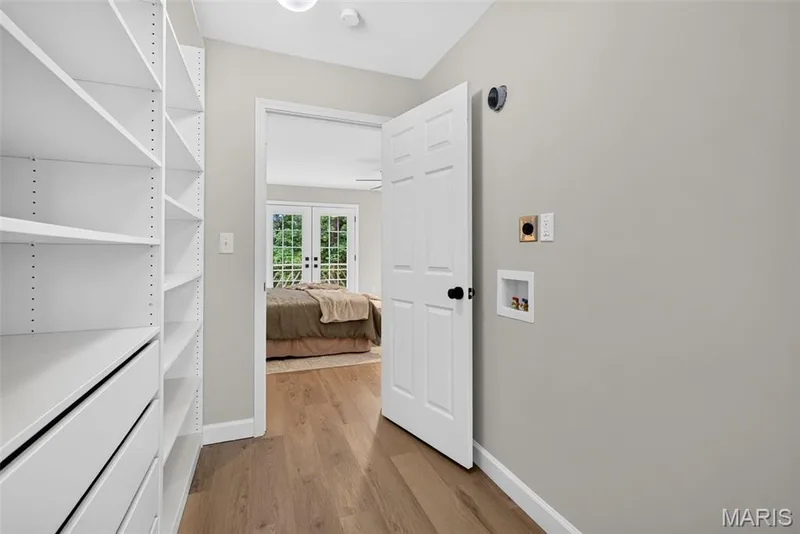 Laundry space #1 in Primary walk -in closet — 1674 Old Baxter Road, Chesterfield, MO 63017