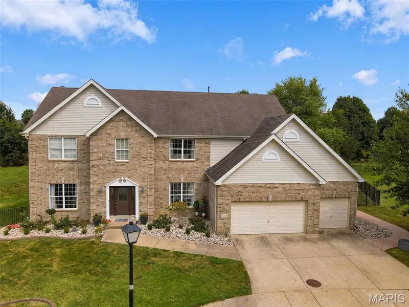 Brick and siding exterior with gabled roof lines — 1000 Gardenbridge Place, St Charles, MO 63303