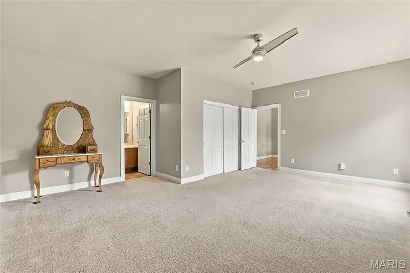 In-law/main floor bedroom adjoins personal full bathroom — 1000 Gardenbridge Place, St Charles, MO 63303