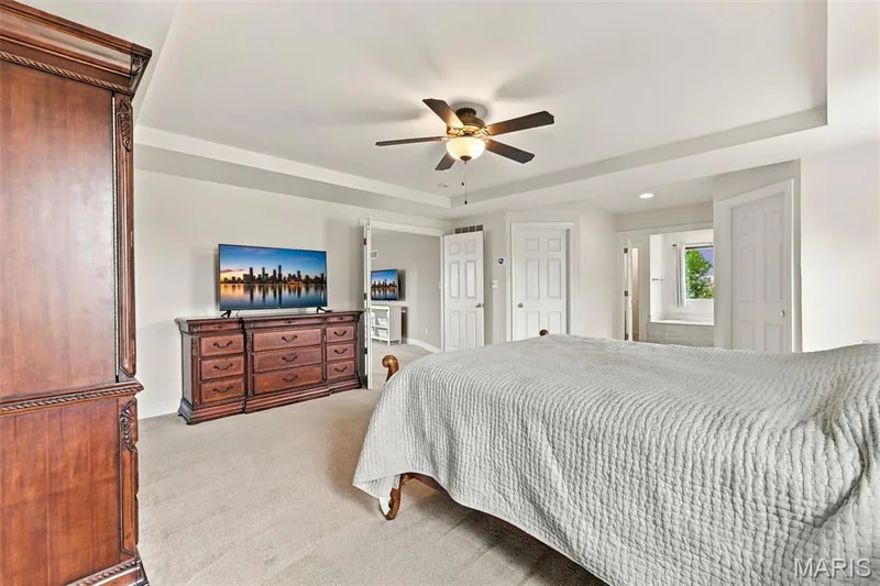 Bedroom has sizable his and hers walk-in closets and adjoins beautiful ensuite — 1000 Gardenbridge Place, St Charles, MO 63303