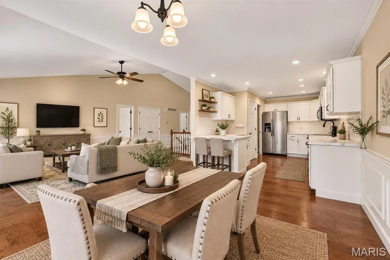 Virtually Staged breakfast room  into kitchen and open to great room — 114 Savannah Terrace, Wentzville, MO 63385