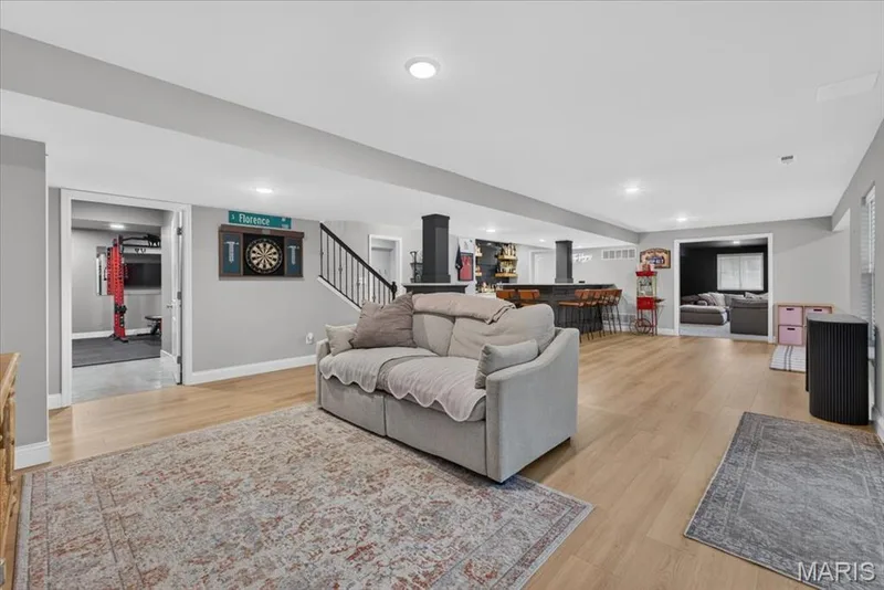 Basement, can see gym, wet bar, and movie room — 512 Spruce Hollow Court, Wentzville, MO 63385