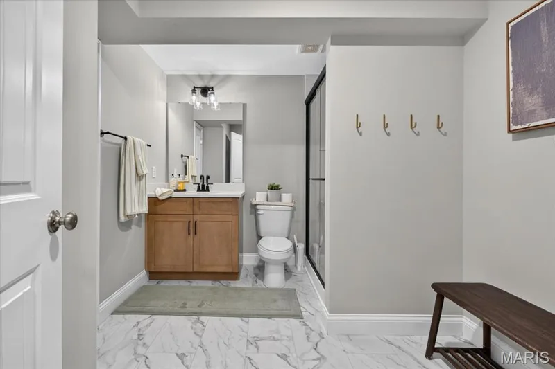 basement full bathroom w/ linen closet and hook nook — 512 Spruce Hollow Court, Wentzville, MO 63385