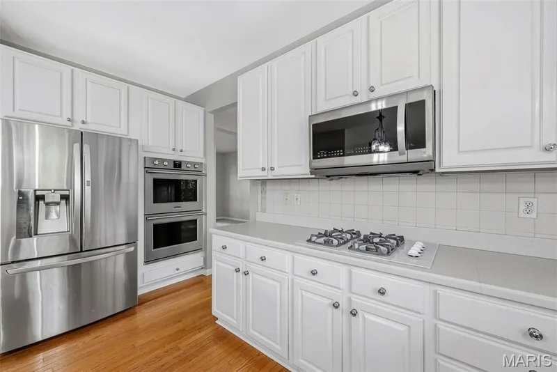Gas Cooktop and Double Wall Ovens in Kitchen — 223 Chestnut Hill Drive, O'Fallon, MO 63368