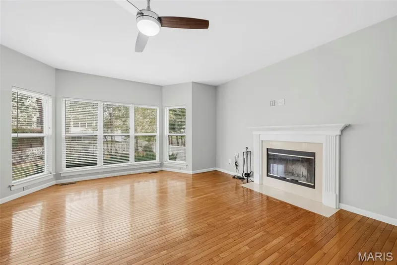 Family Room with 9 Foot Ceilings, Wood Flooring, Wood Burning Fireplace and Bay Window — 223 Chestnut Hill Drive, O'Fallon, MO 63368