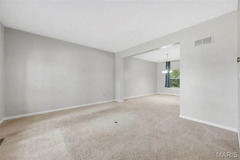 Living Room open to Dining Room — 223 Chestnut Hill Drive, O'Fallon, MO 63368
