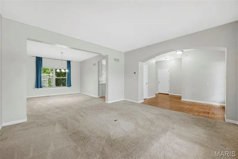 Living Room with Barrel Archway to Entry Foyer — 223 Chestnut Hill Drive, O'Fallon, MO 63368
