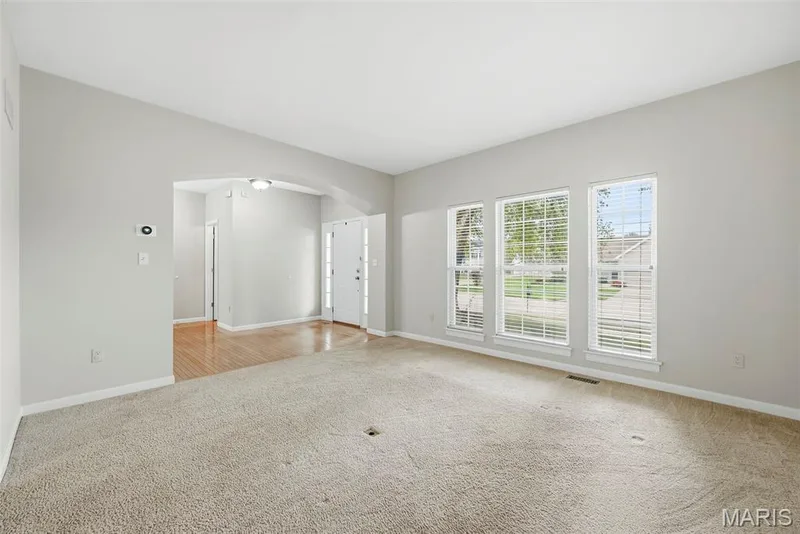 Living Room with Barrel Archway to Entry Foyer — 223 Chestnut Hill Drive, O'Fallon, MO 63368