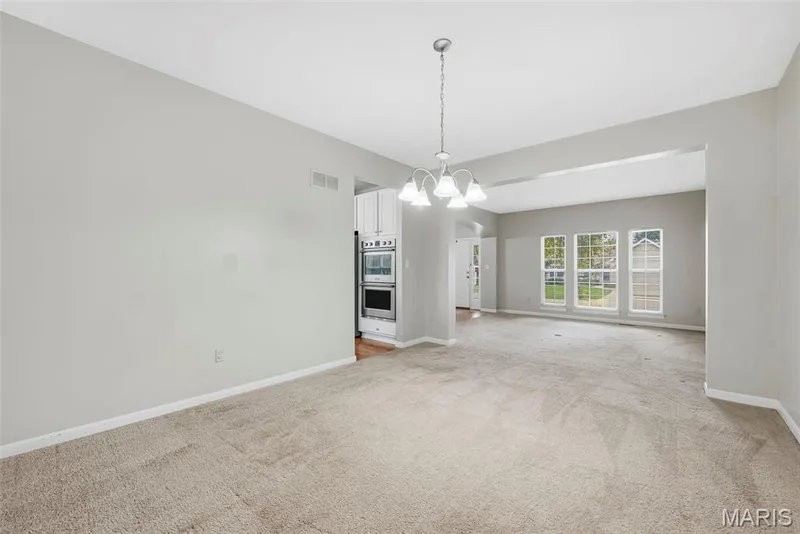 Dining Room and Living Room with 9 Foot Ceilings — 223 Chestnut Hill Drive, O'Fallon, MO 63368