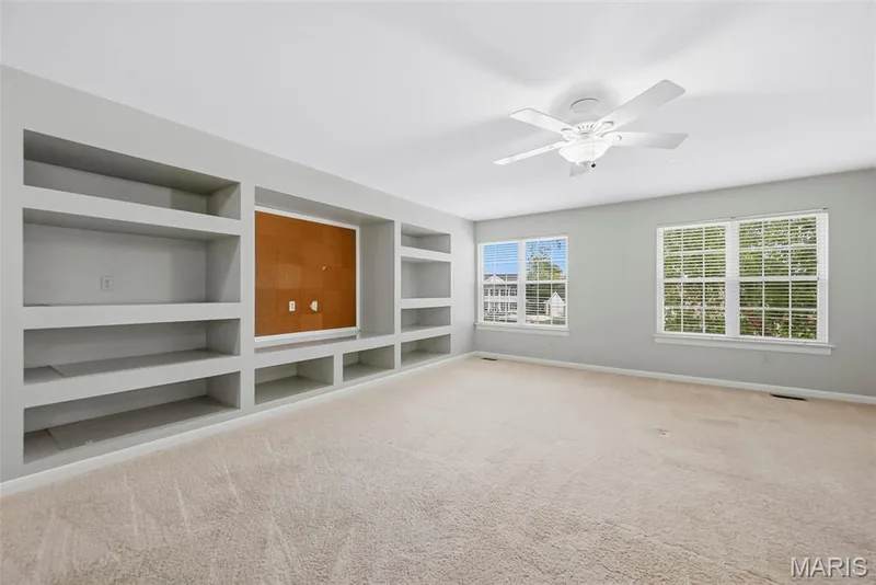 Bonus Room with Wall of Built in Shelving — 223 Chestnut Hill Drive, O'Fallon, MO 63368