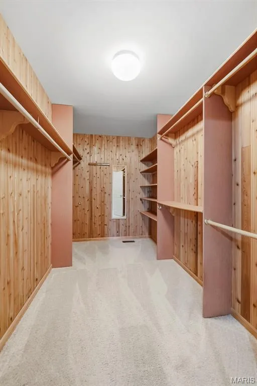 Walk in Closet with Cedar Planks and Custom Organizers in Primary Bedroom — 223 Chestnut Hill Drive, O'Fallon, MO 63368