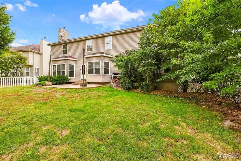 Fenced Backyard with Patio and Mature Foliage — 223 Chestnut Hill Drive, O'Fallon, MO 63368