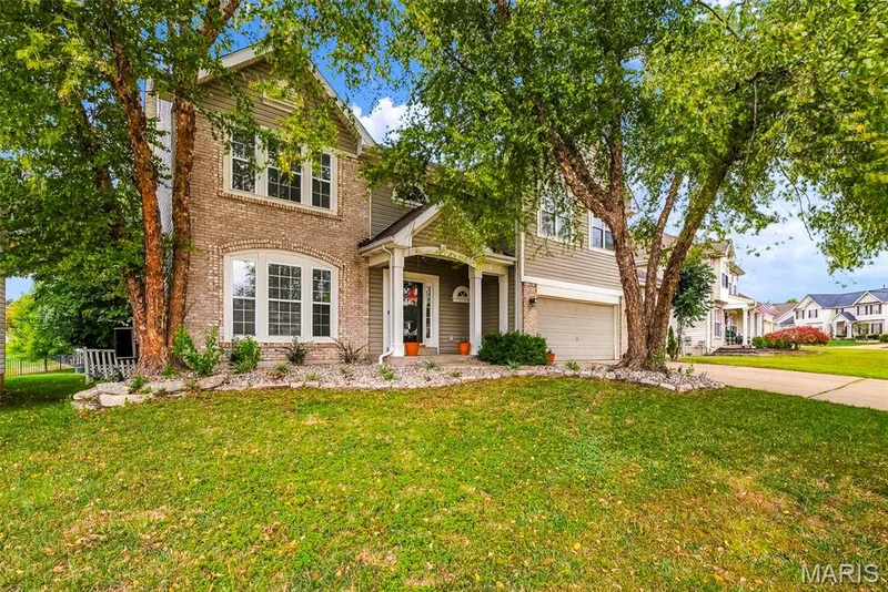 Front Elevation with Landscaping, Lawn Irrigation and Mature Trees — 223 Chestnut Hill Drive, O'Fallon, MO 63368