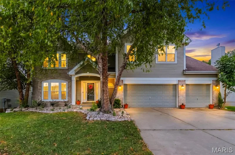 Front Elevation at Dusk — 223 Chestnut Hill Drive, O'Fallon, MO 63368