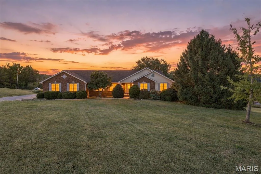 Beautiful sunset picture of the front exterior — 1409 Boone Valley Ridge, Augusta, MO 63332