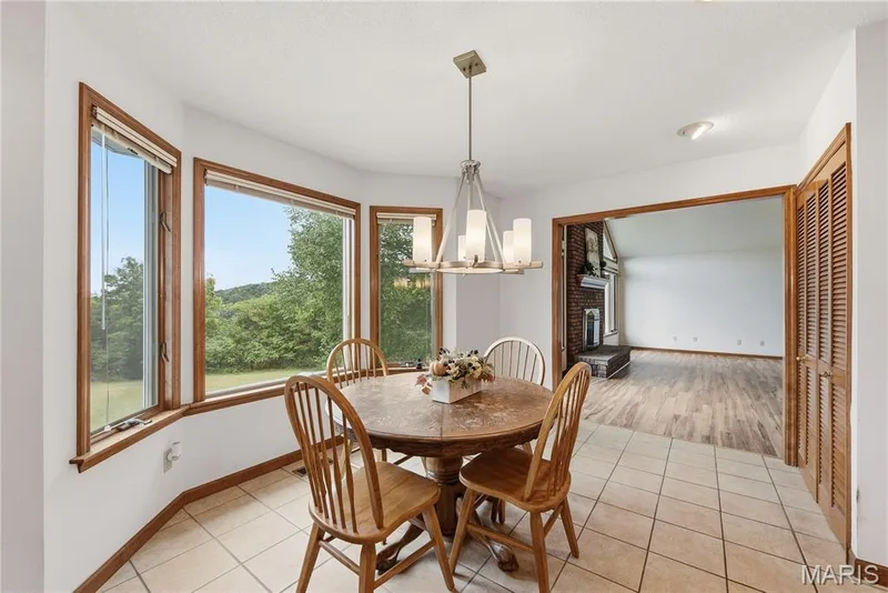 Breakfast room with a bay window offering scenic views — 1409 Boone Valley Ridge, Augusta, MO 63332