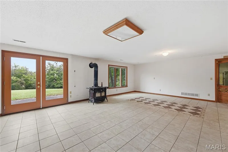 Huge finished lower level with a Vermont Castings wood stove — 1409 Boone Valley Ridge, Augusta, MO 63332