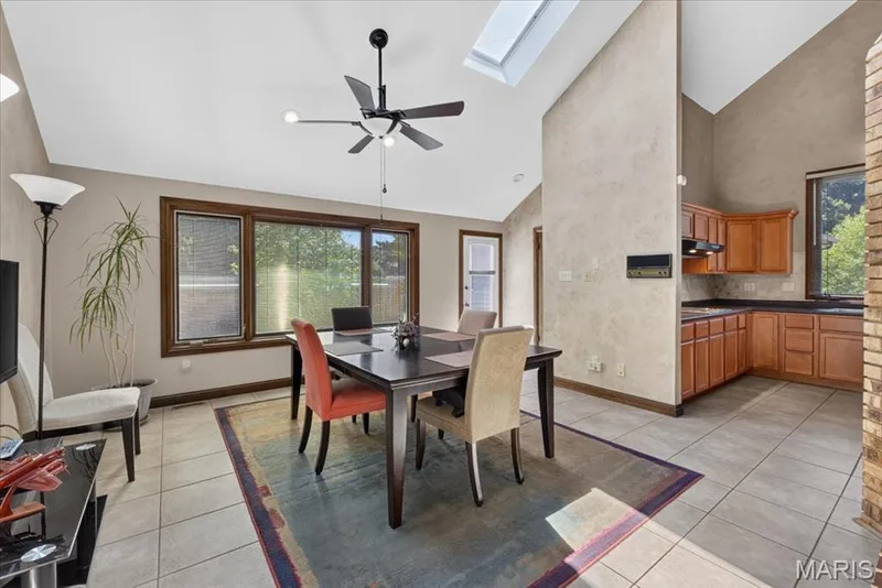 Large breakfast room with vaulted ceiling and skylights — 14418 W Open Meadow Court W, Chesterfield, MO 63017