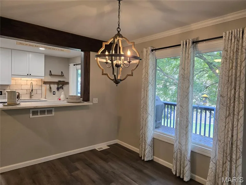 Dining room with pass-through to kitchen — 266 Savoy Drive, Lake St. Louis, MO 63367