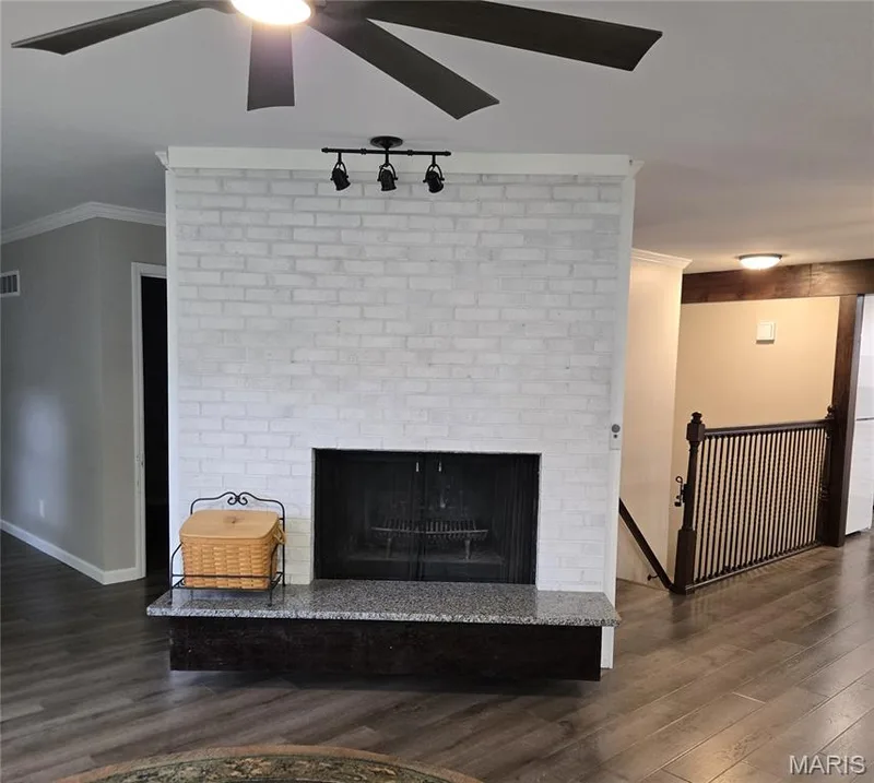 Living room wood-burning fireplace — 266 Savoy Drive, Lake St. Louis, MO 63367