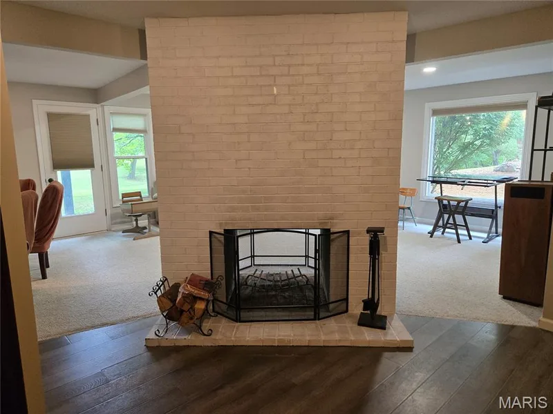View of see-through woodburning fireplace in lower level — 266 Savoy Drive, Lake St. Louis, MO 63367
