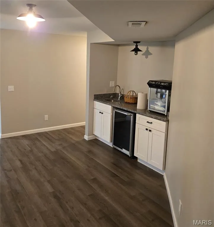 Wet bar and beverage fridge in lower level — 266 Savoy Drive, Lake St. Louis, MO 63367