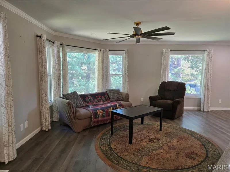 Living room connects to dining room — 266 Savoy Drive, Lake St. Louis, MO 63367