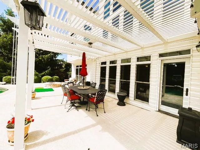 View of patio / terrace with outdoor dining area and a pergola — 1009 Savonne Court, Chesterfield, MO 63005